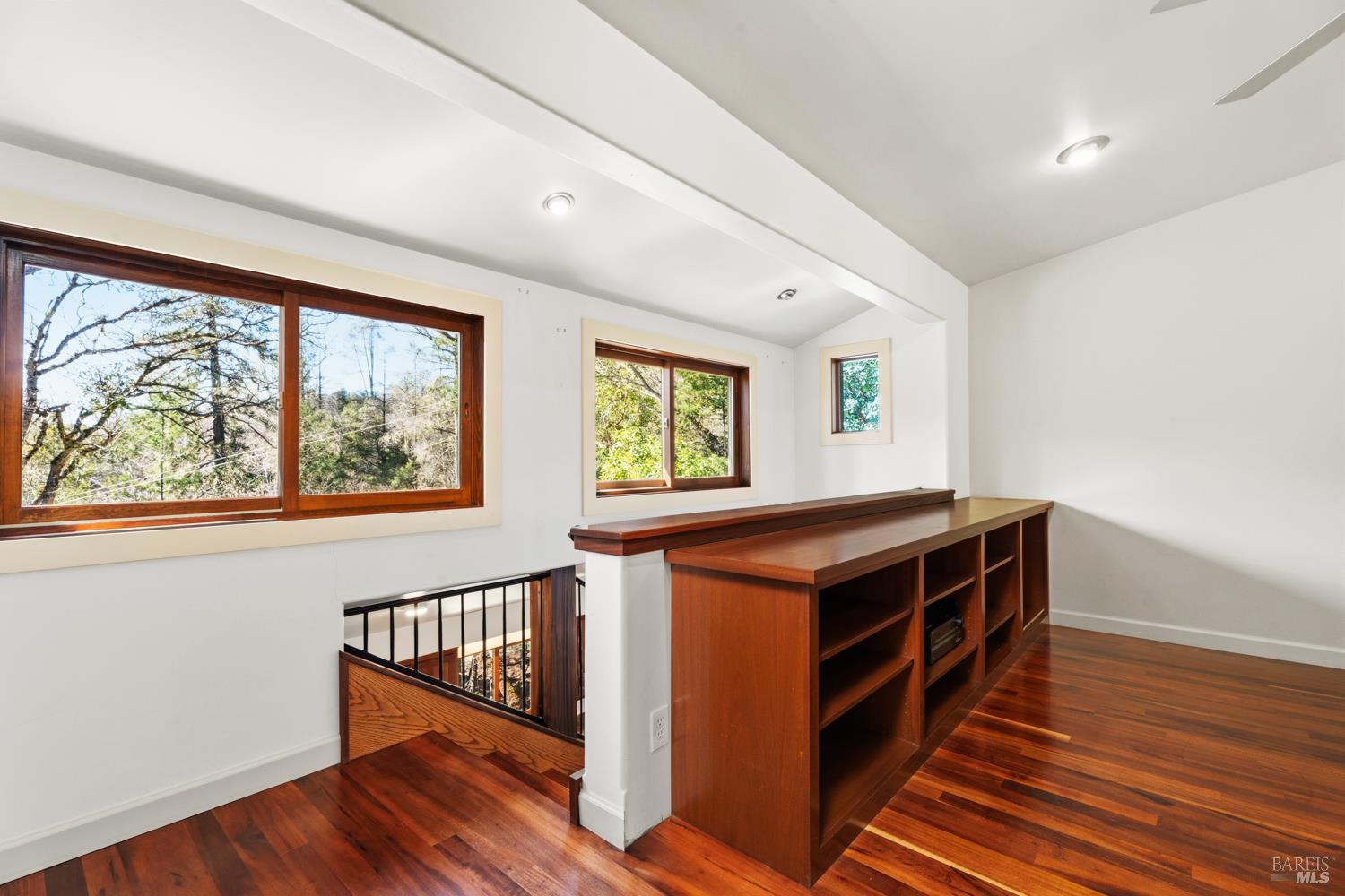 18210 Old Ukiah Pines Road Potter Valley, CA 95469 - Photo 16 of 43 an empty room with wooden floor and windows