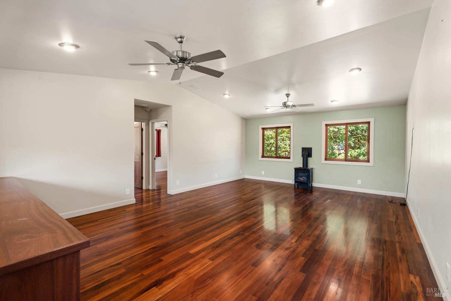 18210 Old Ukiah Pines Road Potter Valley, CA 95469 - Photo 17 of 43 a view of an empty room with window and wooden floor