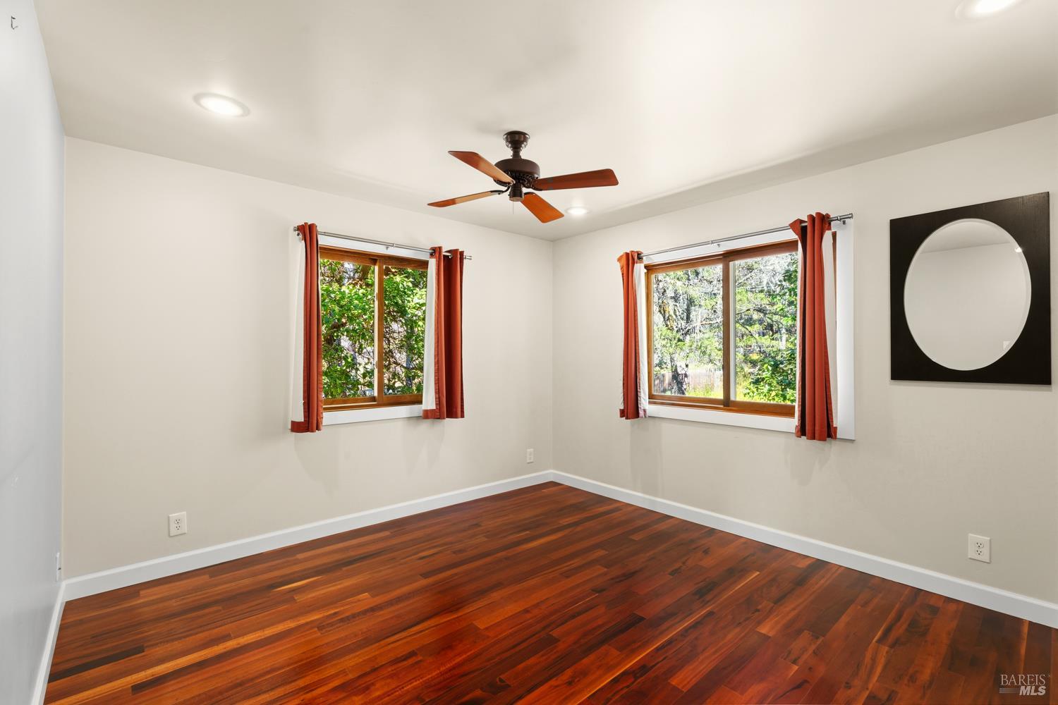 18210 Old Ukiah Pines Road Potter Valley, CA 95469 - Photo 19 of 43 wooden floor in an empty room with a window