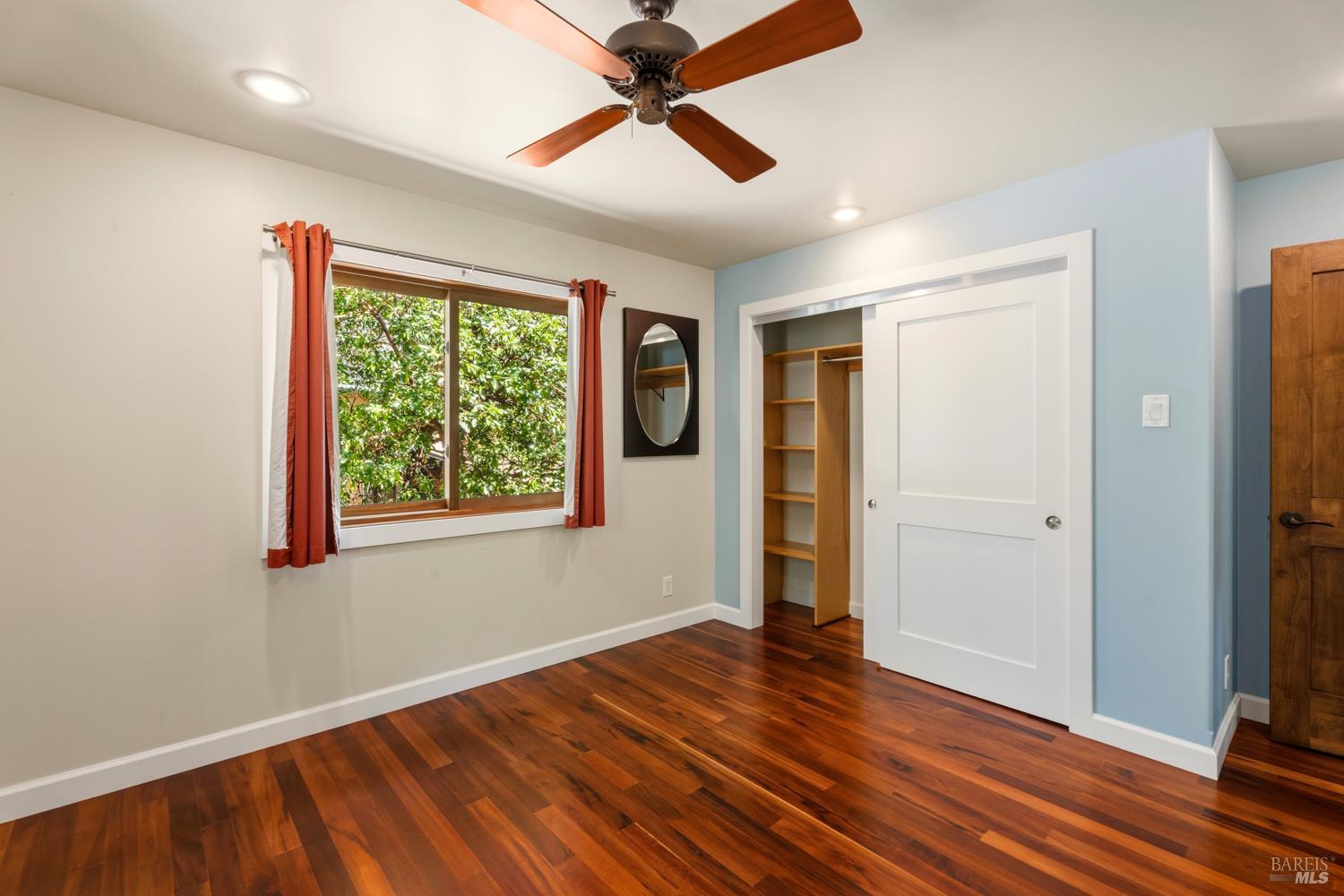 18210 Old Ukiah Pines Road Potter Valley, CA 95469 - Photo 20 of 43 a view of empty room with wooden floor and fan