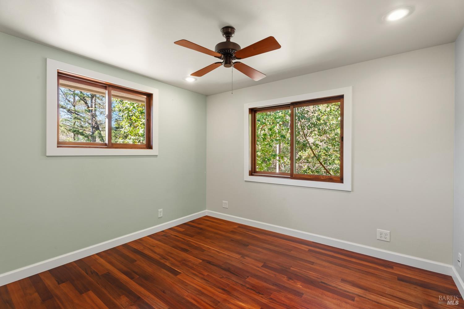18210 Old Ukiah Pines Road Potter Valley, CA 95469 - Photo 21 of 43 a view of empty room with wooden floor and fan