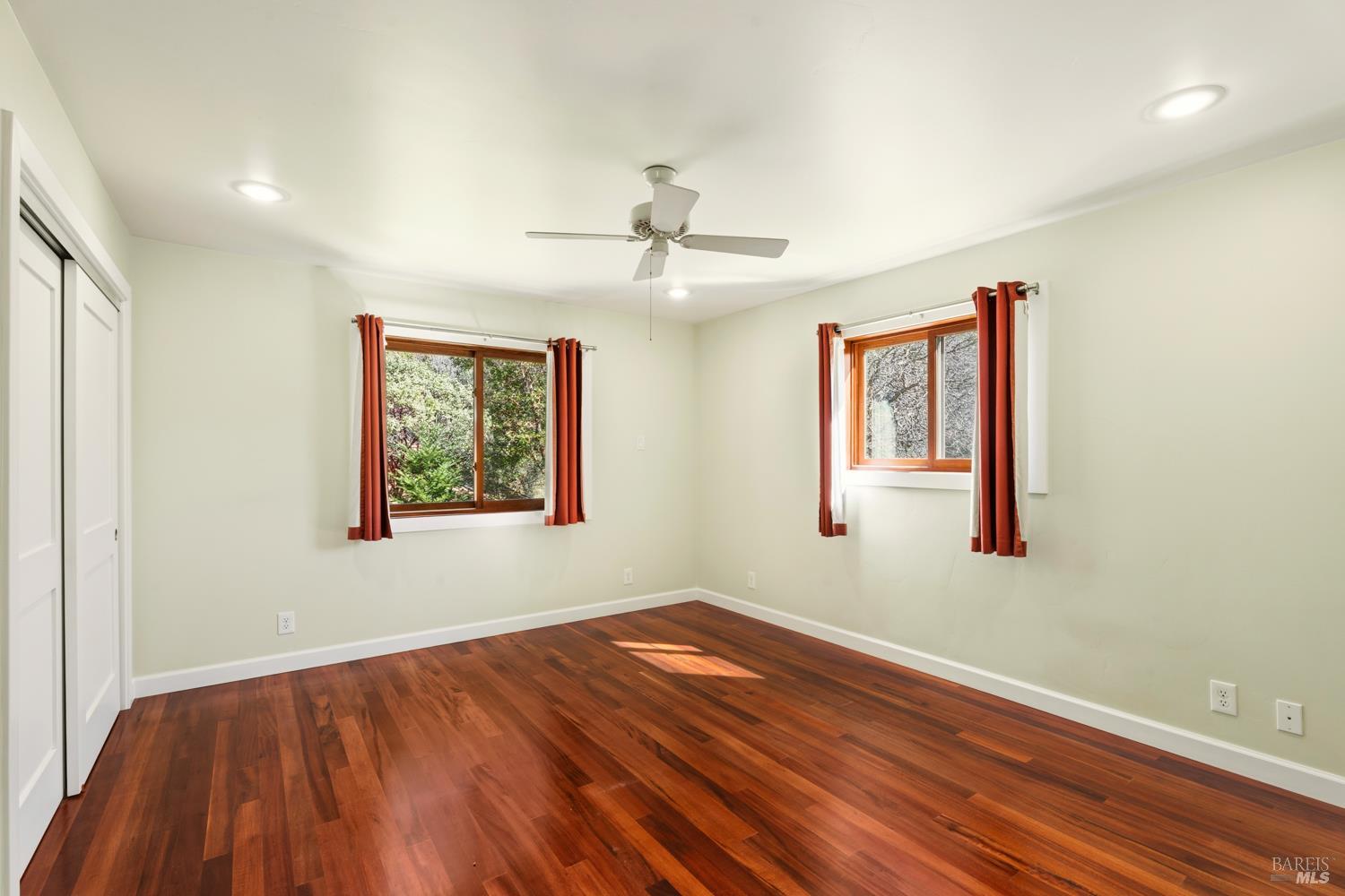 18210 Old Ukiah Pines Road Potter Valley, CA 95469 - Photo 22 of 43 a view of a room with wooden floor and window