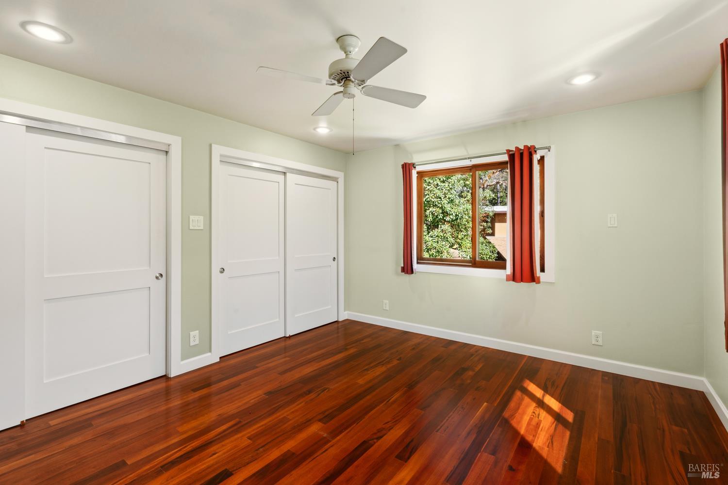 18210 Old Ukiah Pines Road Potter Valley, CA 95469 - Photo 23 of 43 wooden floor in an empty room with a window