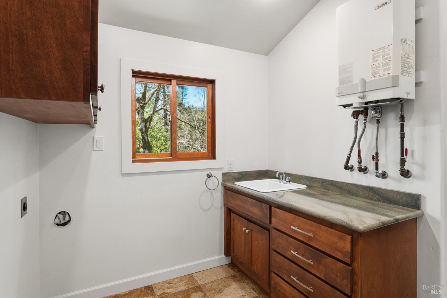 18210 Old Ukiah Pines Road Potter Valley, CA 95469 - Photo 26 of 43 a sink and a window