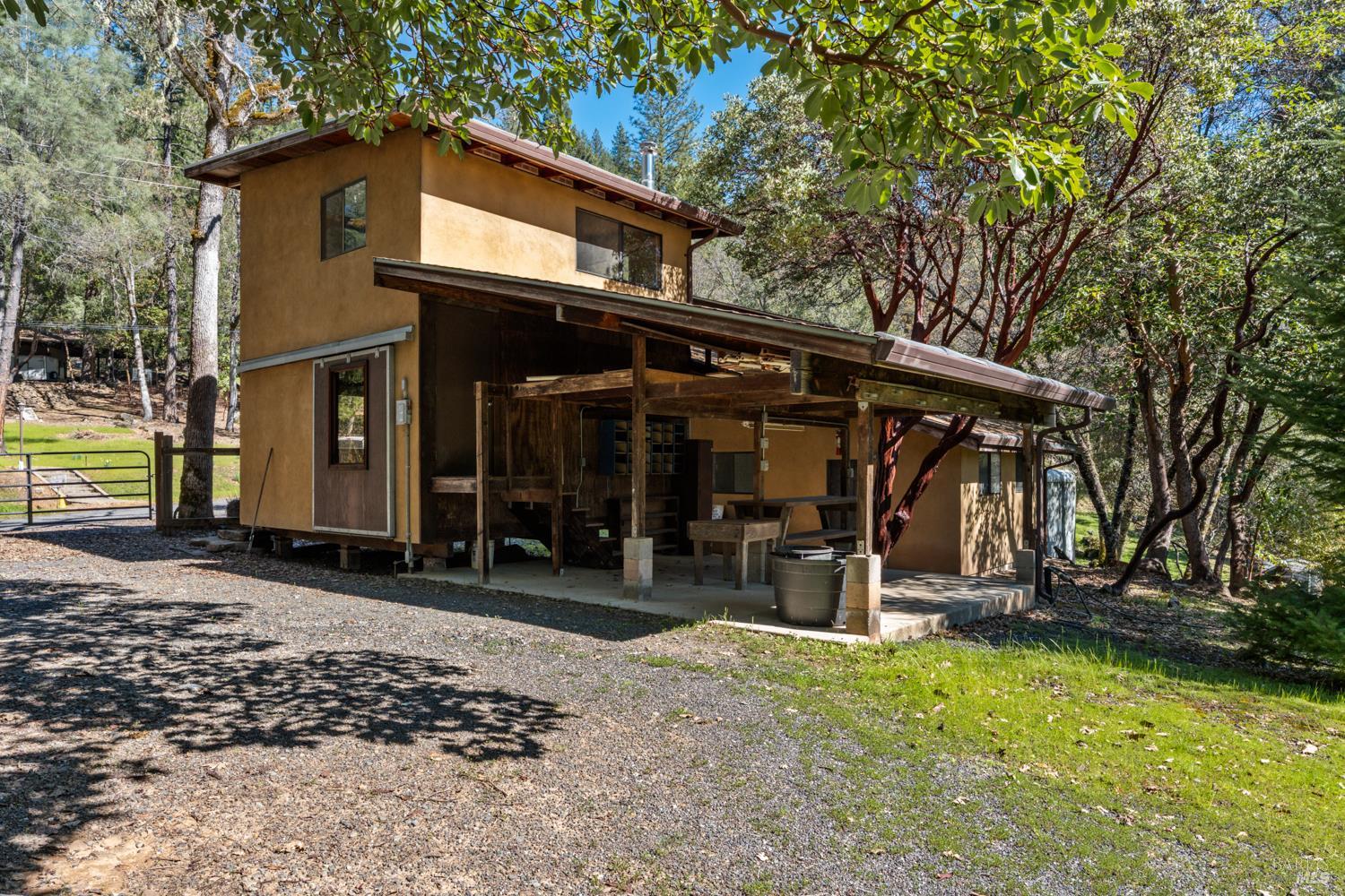 18210 Old Ukiah Pines Road Potter Valley, CA 95469 - Photo 34 of 43 a view of a car park in front of a house