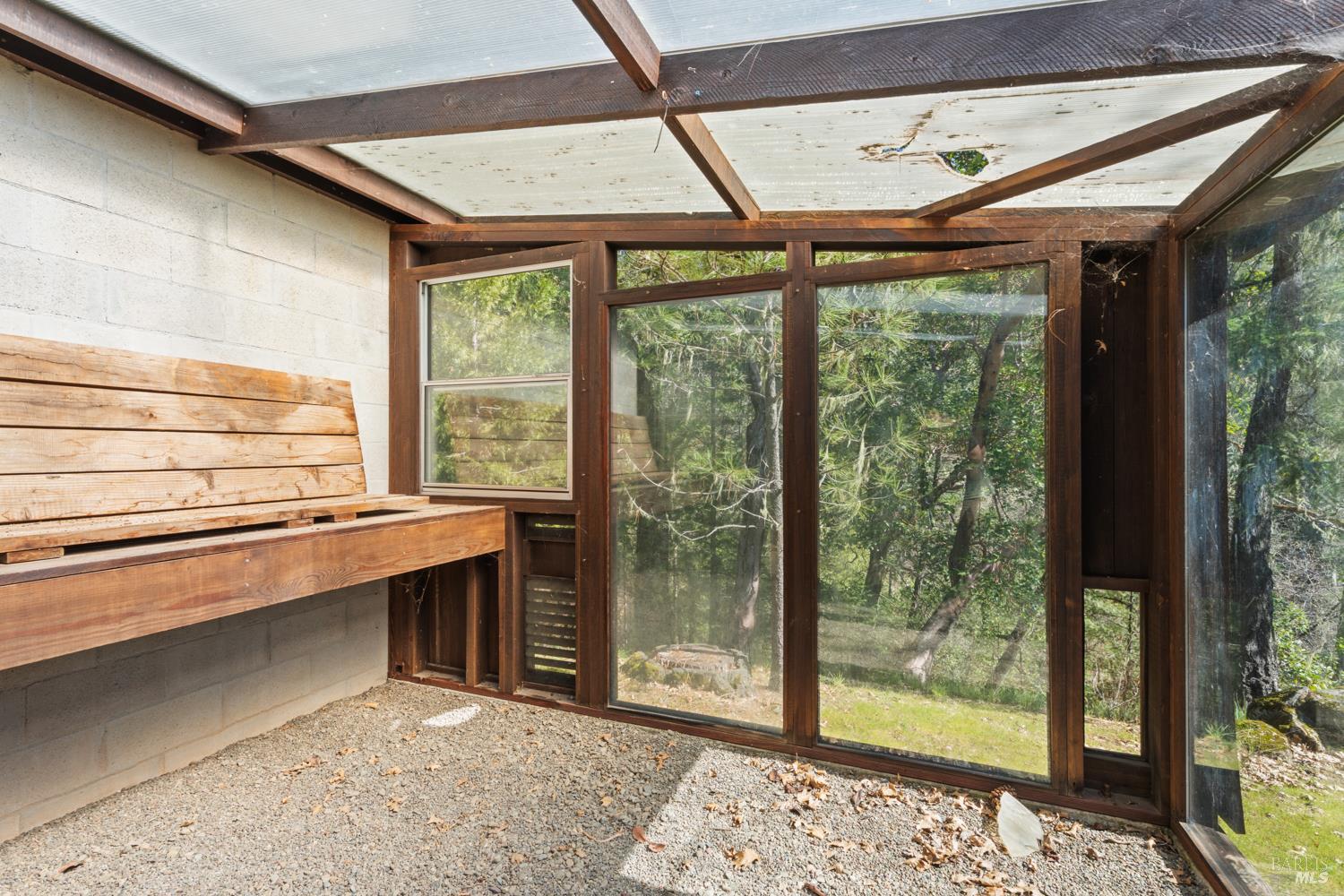 18210 Old Ukiah Pines Road Potter Valley, CA 95469 - Photo 38 of 43 a room with a large bed and a large window