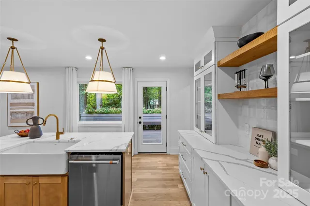 a kitchen with a sink and cabinets