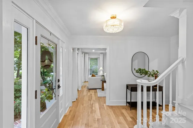 a view of hall way with furniture