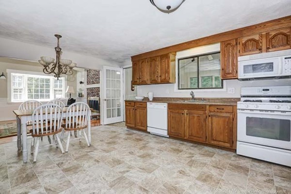 9 Rindge Road Andover, MA 01810 - Photo 6 of 28 a kitchen with a stove a sink and a refrigerator