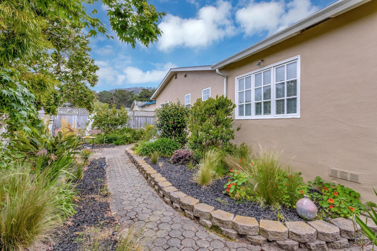 744 Arleen Way Pacifica, CA 94044 - Photo 5 of 9 a front view of a house with a yard