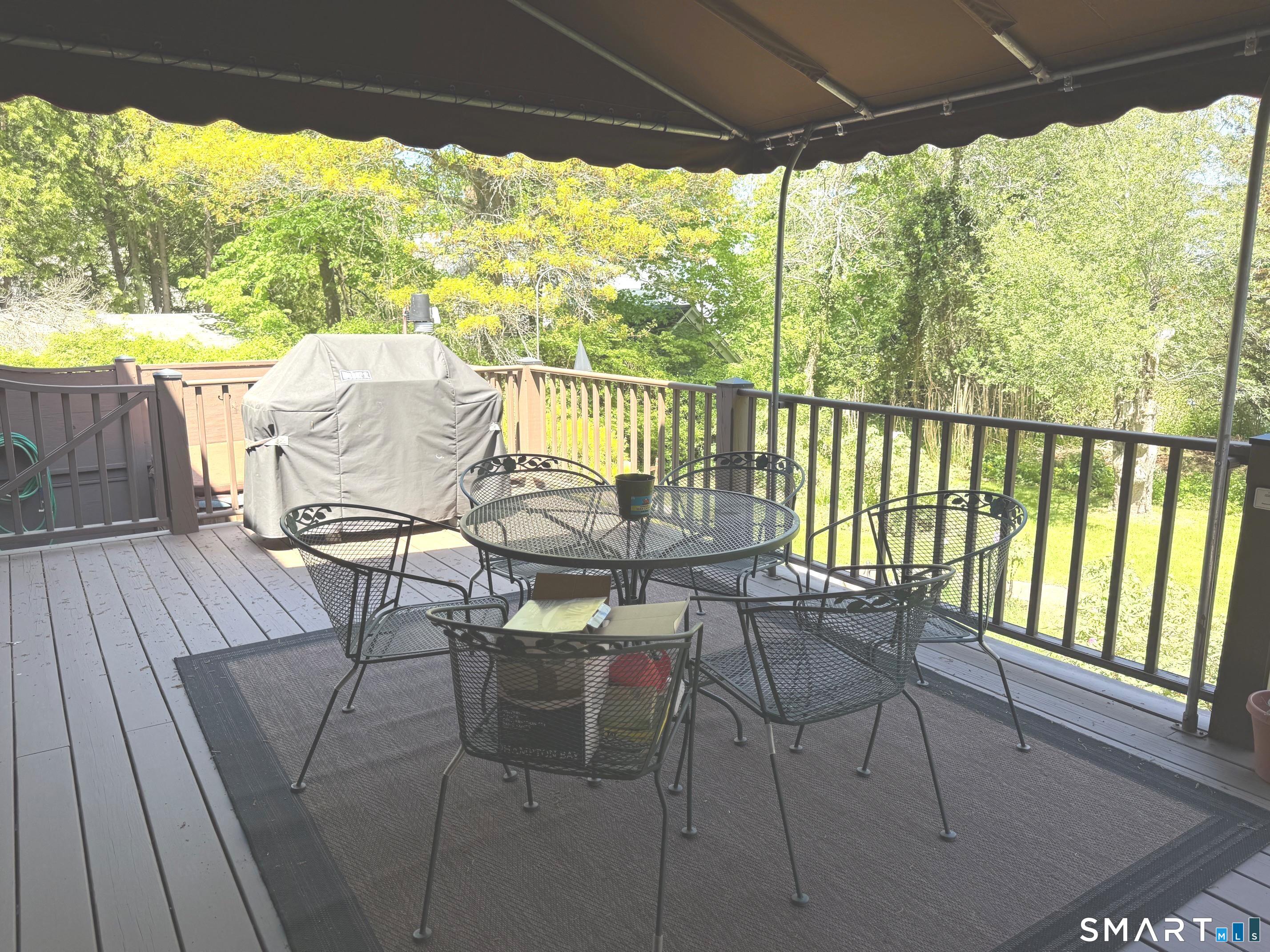8 Ivy Road Stonington, CT 06355 - Photo 25 of 30 a view of a porch with furniture and wooden floor