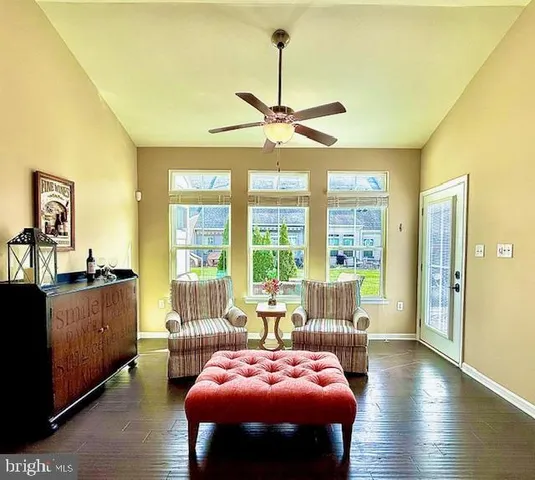 a view of a livingroom with furniture window and wooden floor