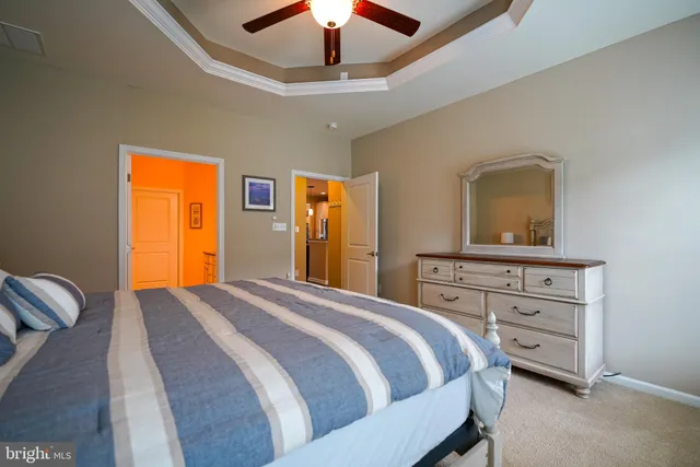 a bedroom with a bed and a dresser