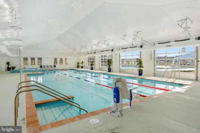 a view of a swimming pool and lounge chair