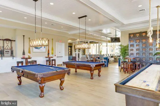 a living room with furniture a table and a chandelier