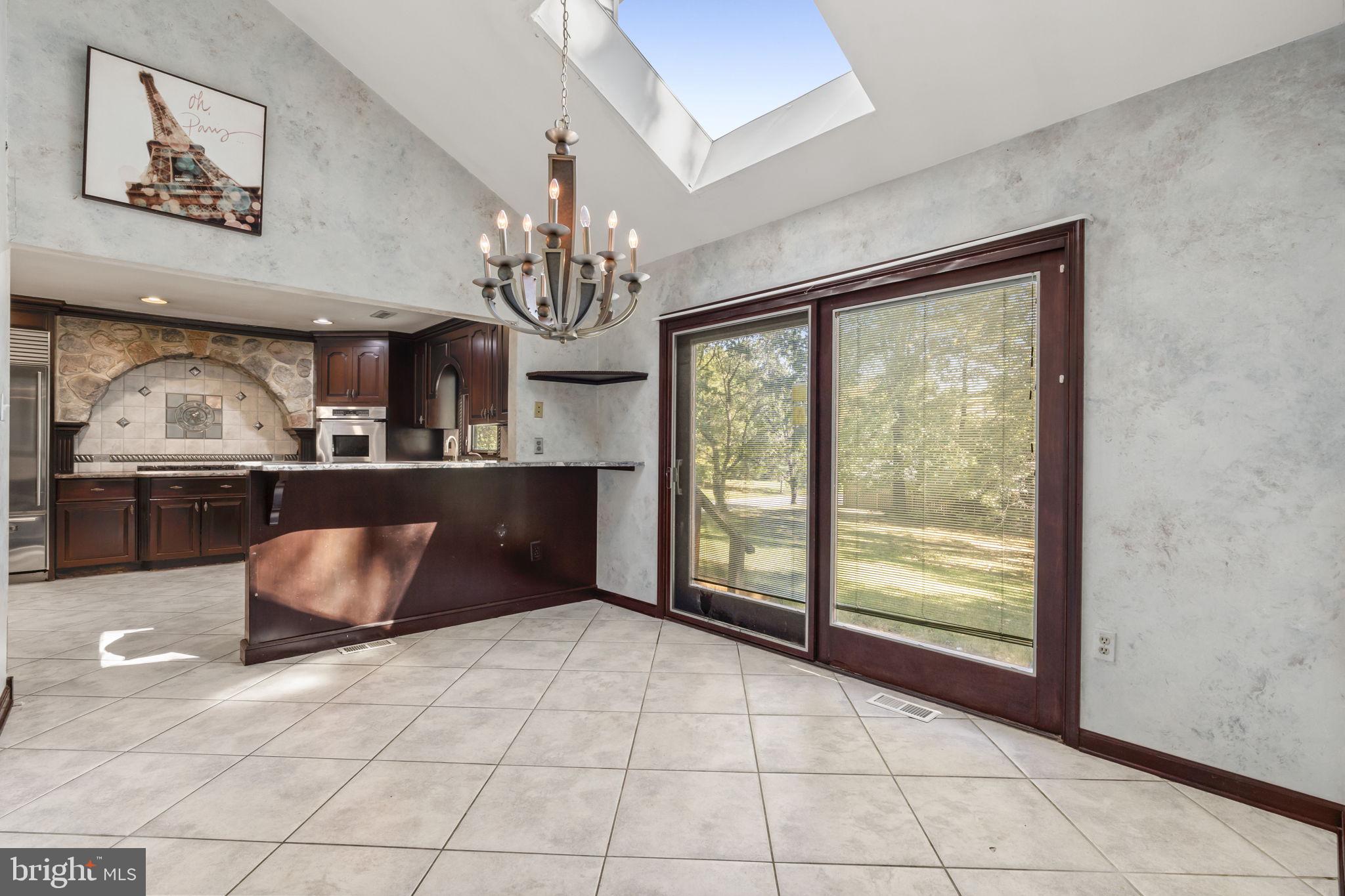 1 Wayne Circle Lower Gwynedd, PA 19002 - Photo 11 of 44 Skylight + Slider Offer Abundance of Natural Light