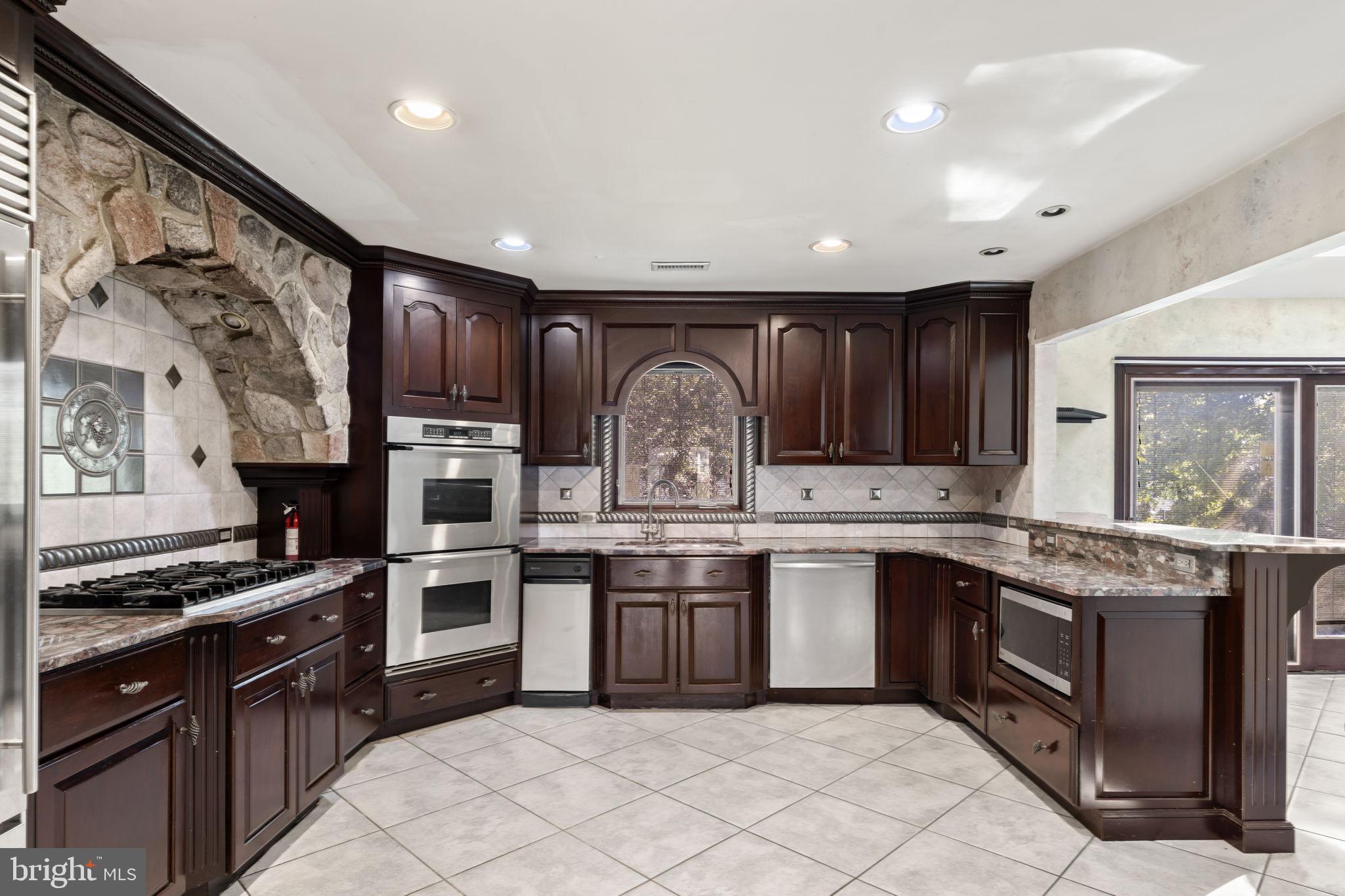 1 Wayne Circle Lower Gwynedd, PA 19002 - Photo 6 of 44 Chef's Gourmet Kitchen with Custom Stone Range