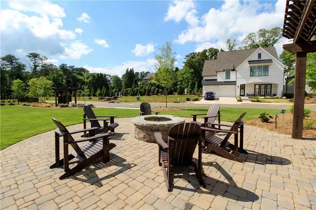 a building outdoor space with patio furniture and potted plants