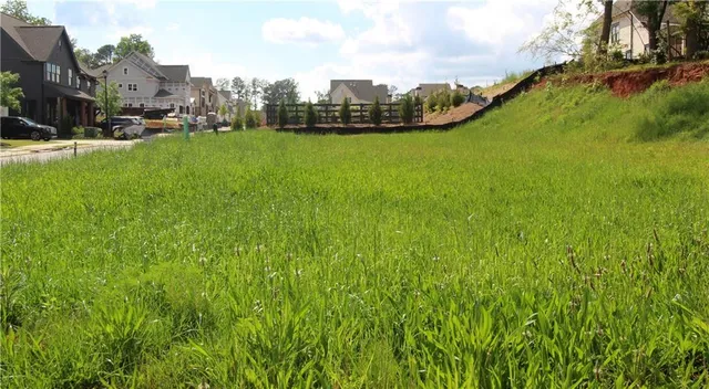 a view of a street with houses on both side of it
