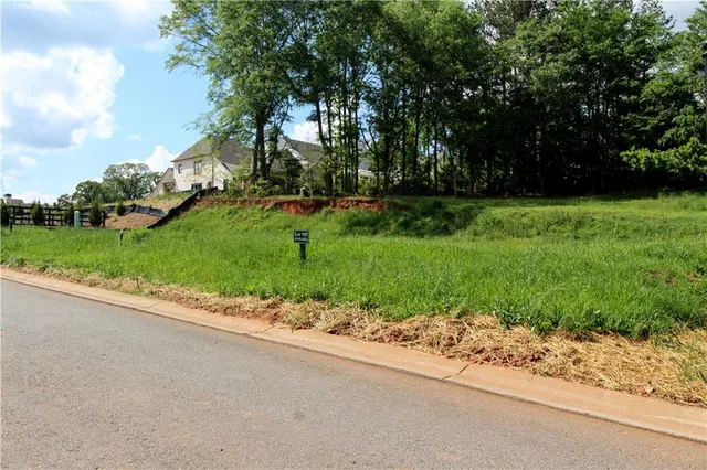 a view of a swimming pool with an outdoor space and seating area