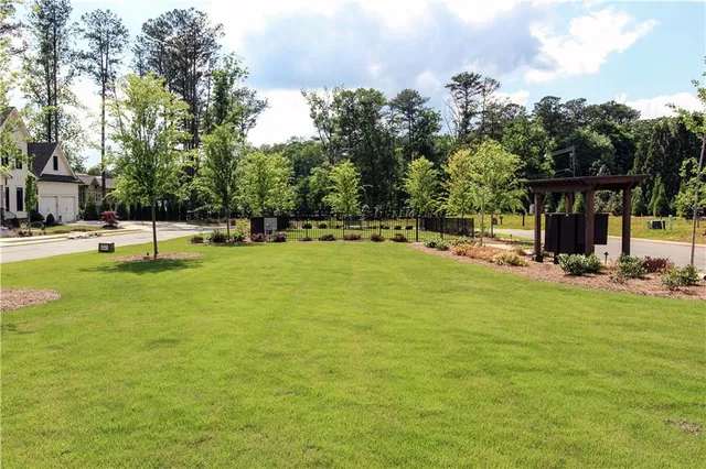 a view of a swimming pool with a yard