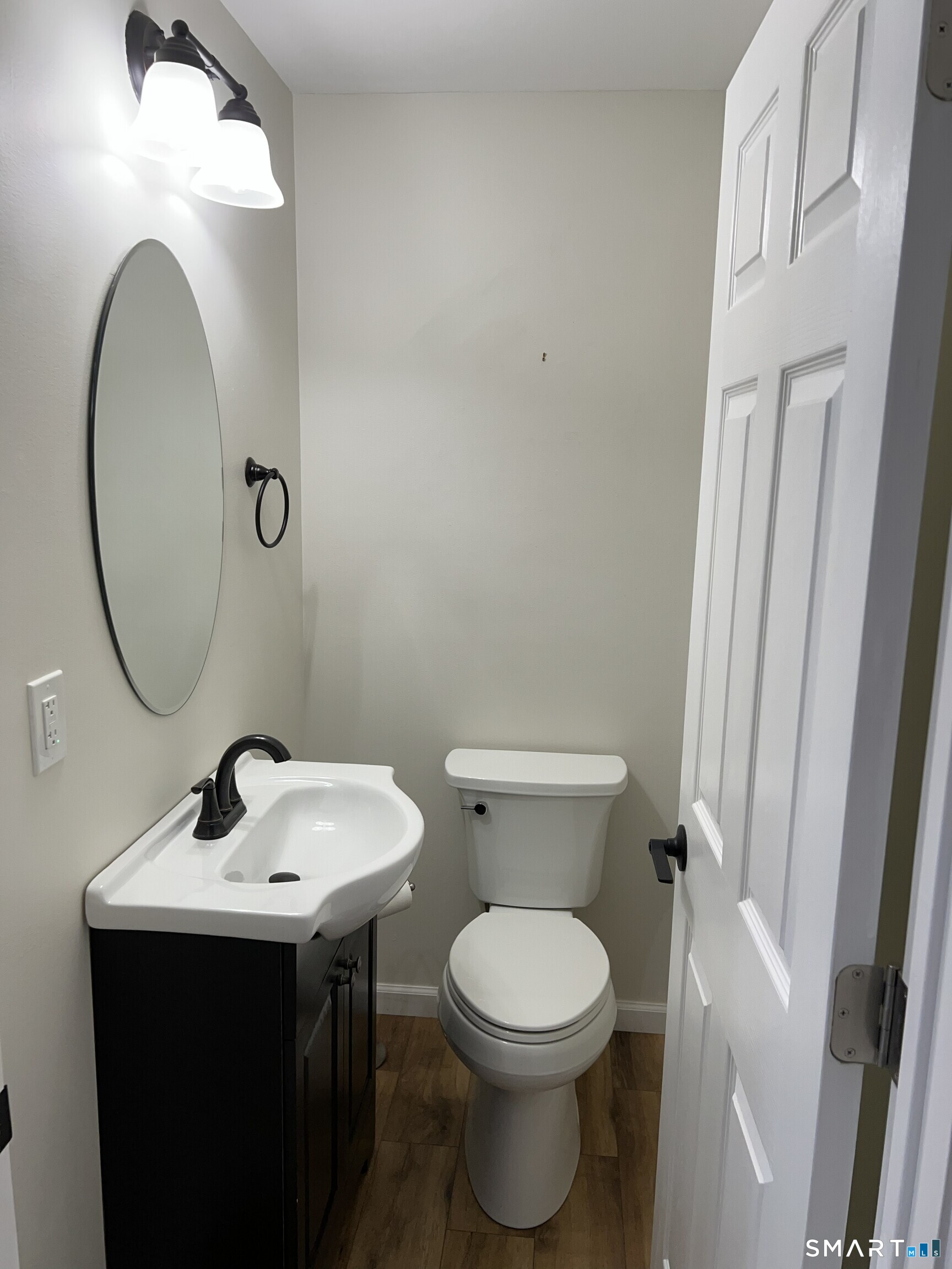 82 Bingham Street Bristol, CT 06010 - Photo 18 of 40 a bathroom with a toilet sink and mirror
