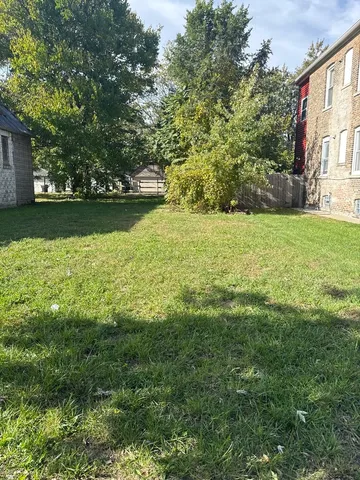 a view of yard with swimming pool