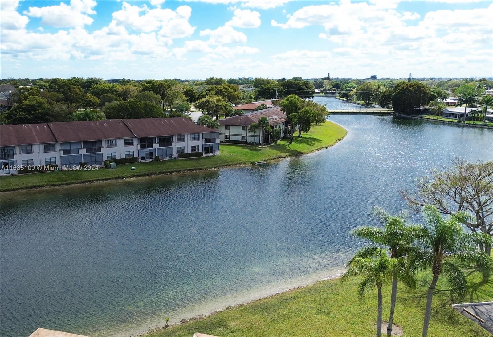 9626 West McNab Road, Unit 206 Tamarac, FL 33321 - Photo 21 of 21 an aerial view of a house with a garden and lake view