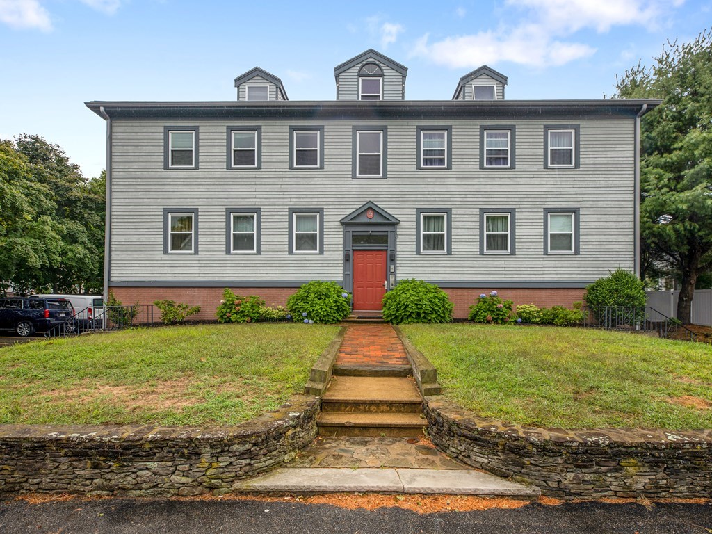 15 Church Street, Unit 8 Natick, MA 01760 - Photo 1 of 14 a front view of a house with a yard