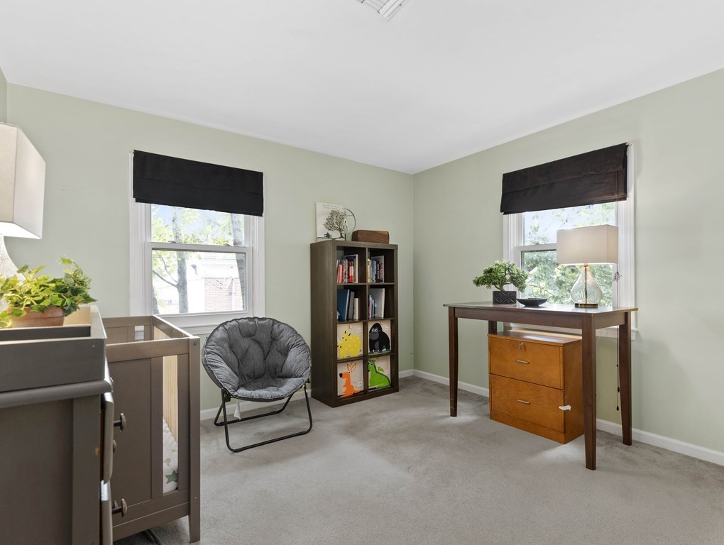 15 Church Street, Unit 8 Natick, MA 01760 - Photo 11 of 14 a living room with furniture and a window