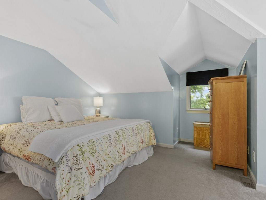 15 Church Street, Unit 8 Natick, MA 01760 - Photo 8 of 14 a bedroom with a bed and dresser