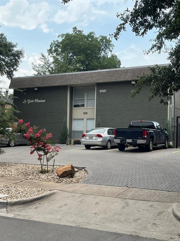 4020 Rawlins Street, Unit 102 Dallas, TX 75219 - Photo 1 of 1 a view of a car parked in front of a house