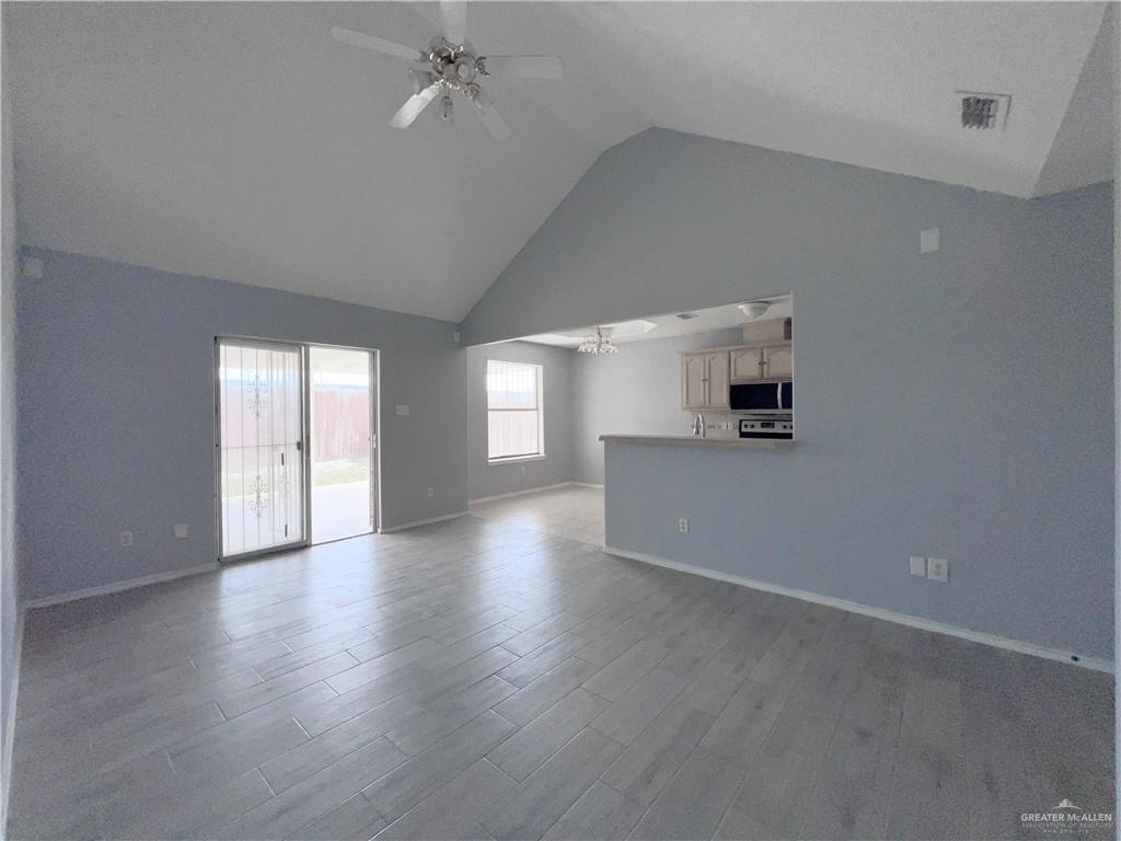 5716 North 38th Street McAllen, TX 78504 - Photo 22 of 28 wooden floor in an empty room with a window