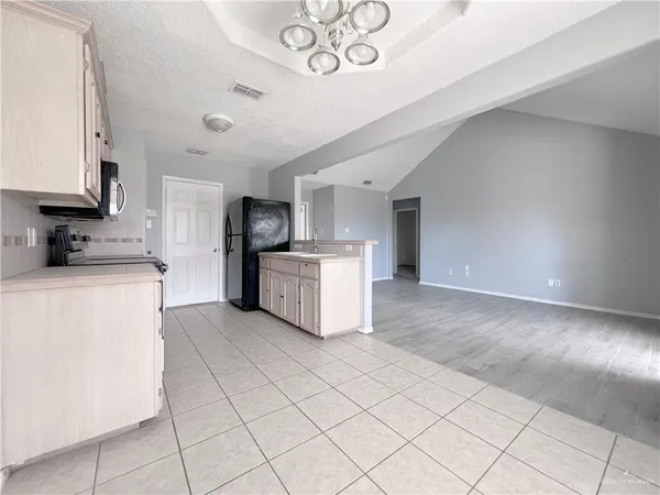 a kitchen with a cabinets and window