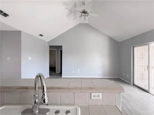 a view of a kitchen with a sink and cabinet
