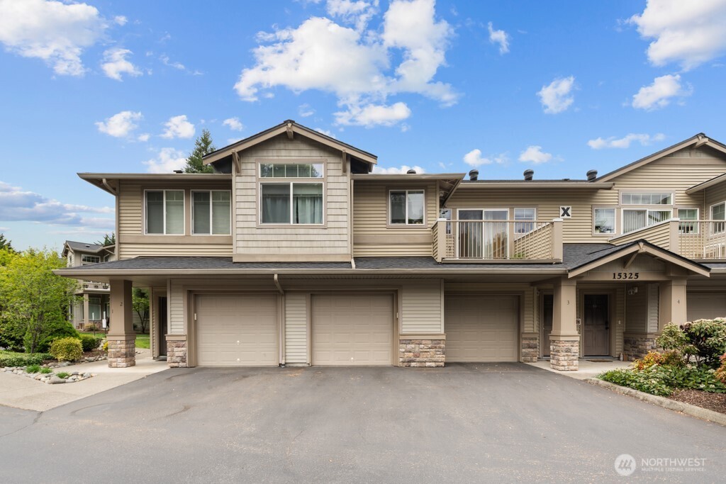 15325 Southeast 155th Place, Unit X1 Renton, WA 98058 - Photo 1 of 21 a front view of a house with yard