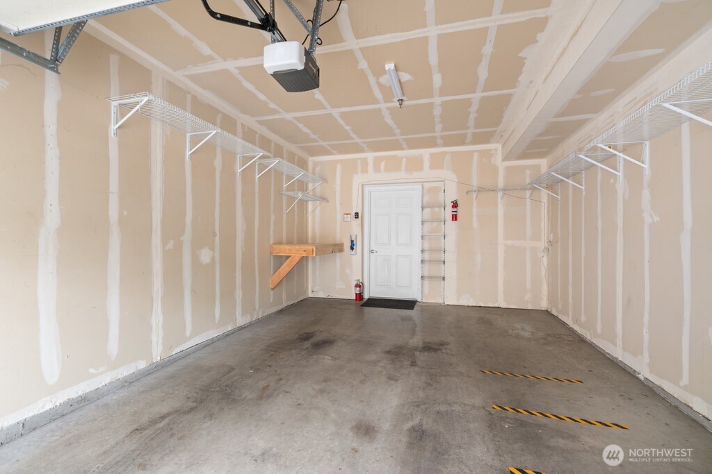 15325 Southeast 155th Place, Unit X1 Renton, WA 98058 - Photo 15 of 21 an empty room with a ceiling fan and stairs