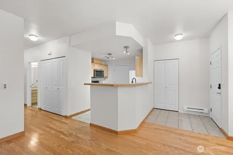 a view of a kitchen cabinets and wooden floor