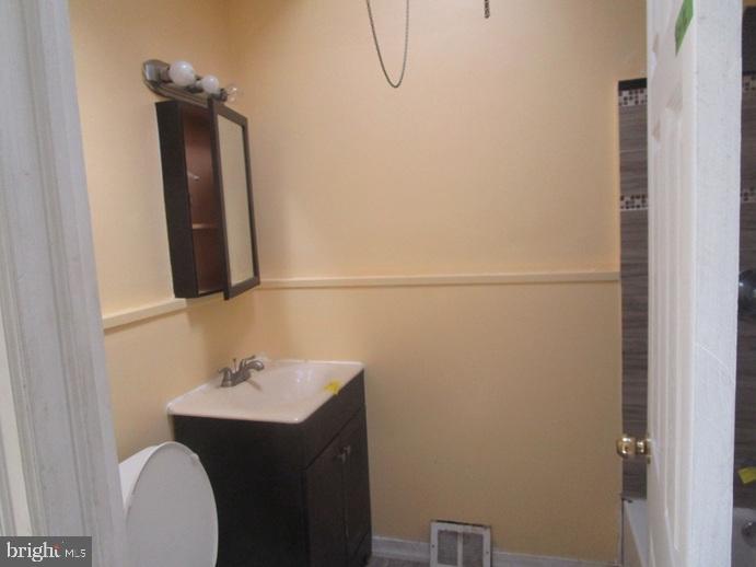 8149 Leon Street Philadelphia, PA 19136 - Photo 12 of 19 a bathroom with a sink and mirror