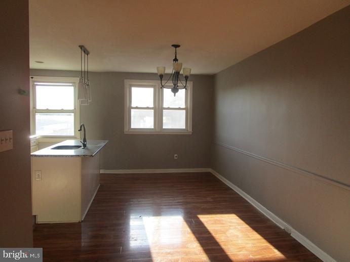 8149 Leon Street Philadelphia, PA 19136 - Photo 7 of 19 a view of empty room with wooden floor and fan