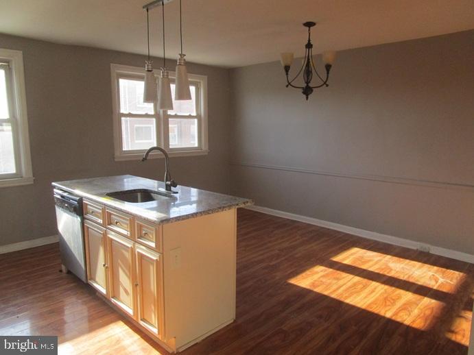 8149 Leon Street Philadelphia, PA 19136 - Photo 8 of 19 a kitchen with a sink and wooden floor