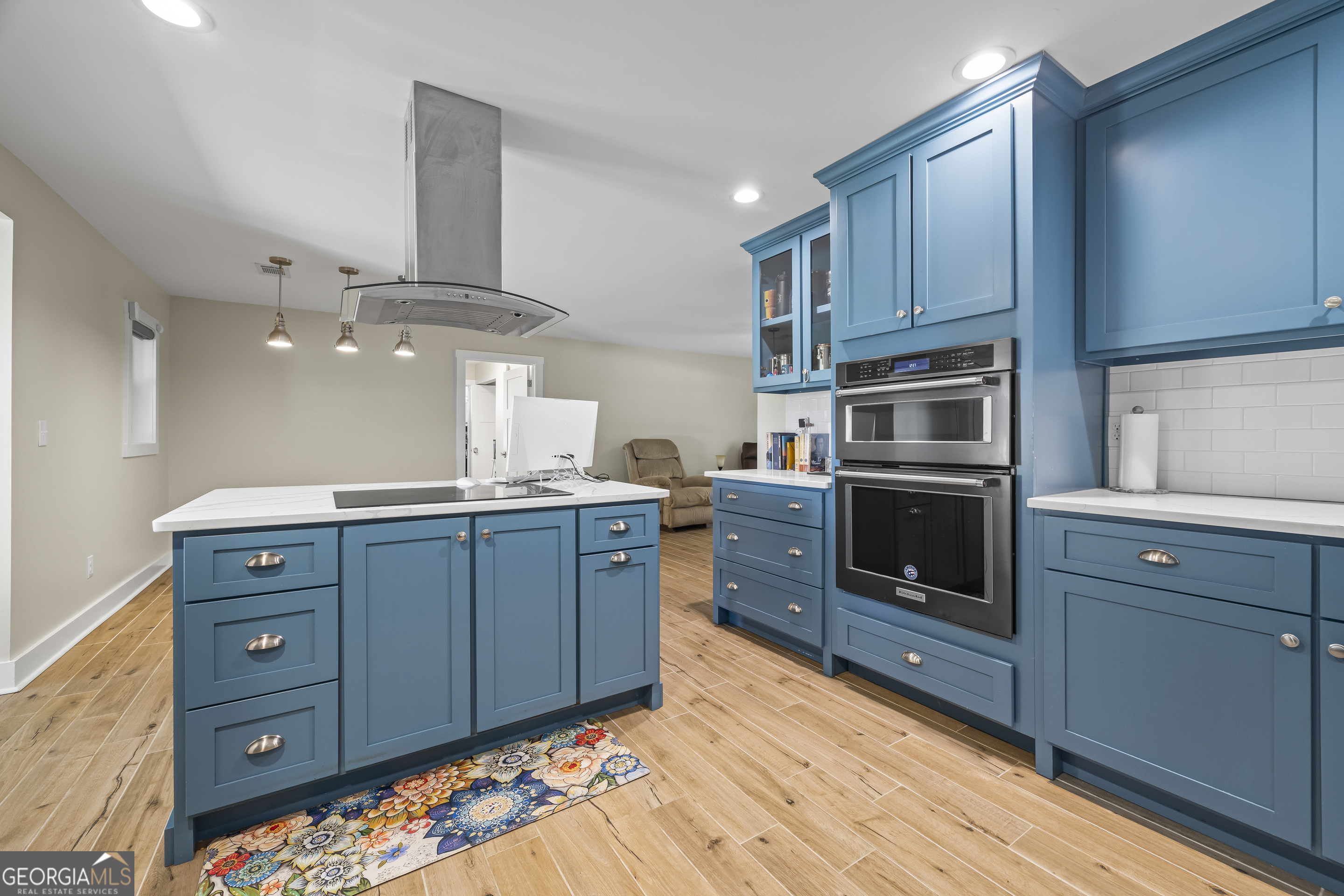 711 Shackelford Road Royston, GA 30662 - Photo 19 of 50 a kitchen with wooden cabinets and a stove top oven