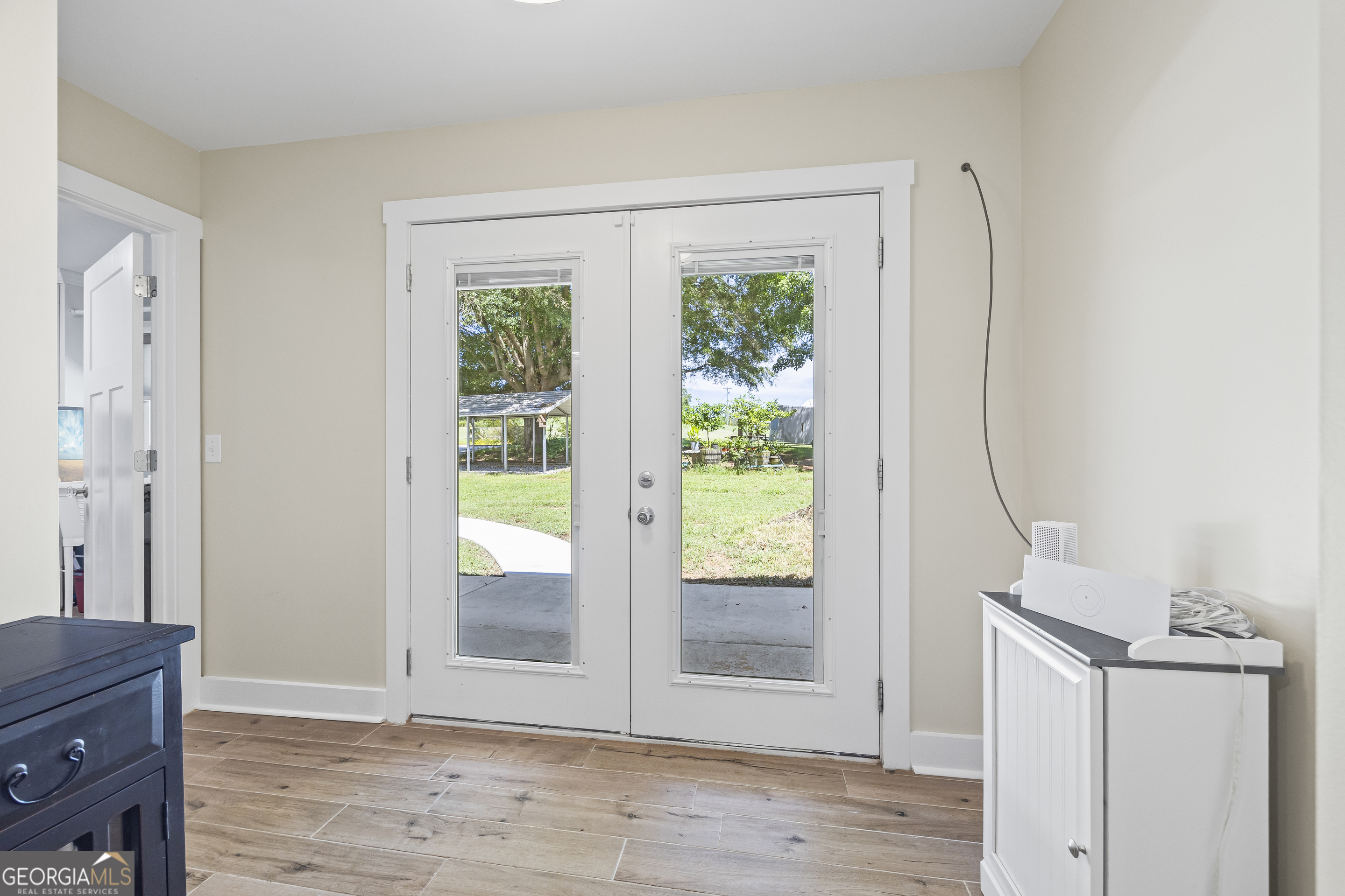 711 Shackelford Road Royston, GA 30662 - Photo 21 of 50 an empty room with wooden floor and windows