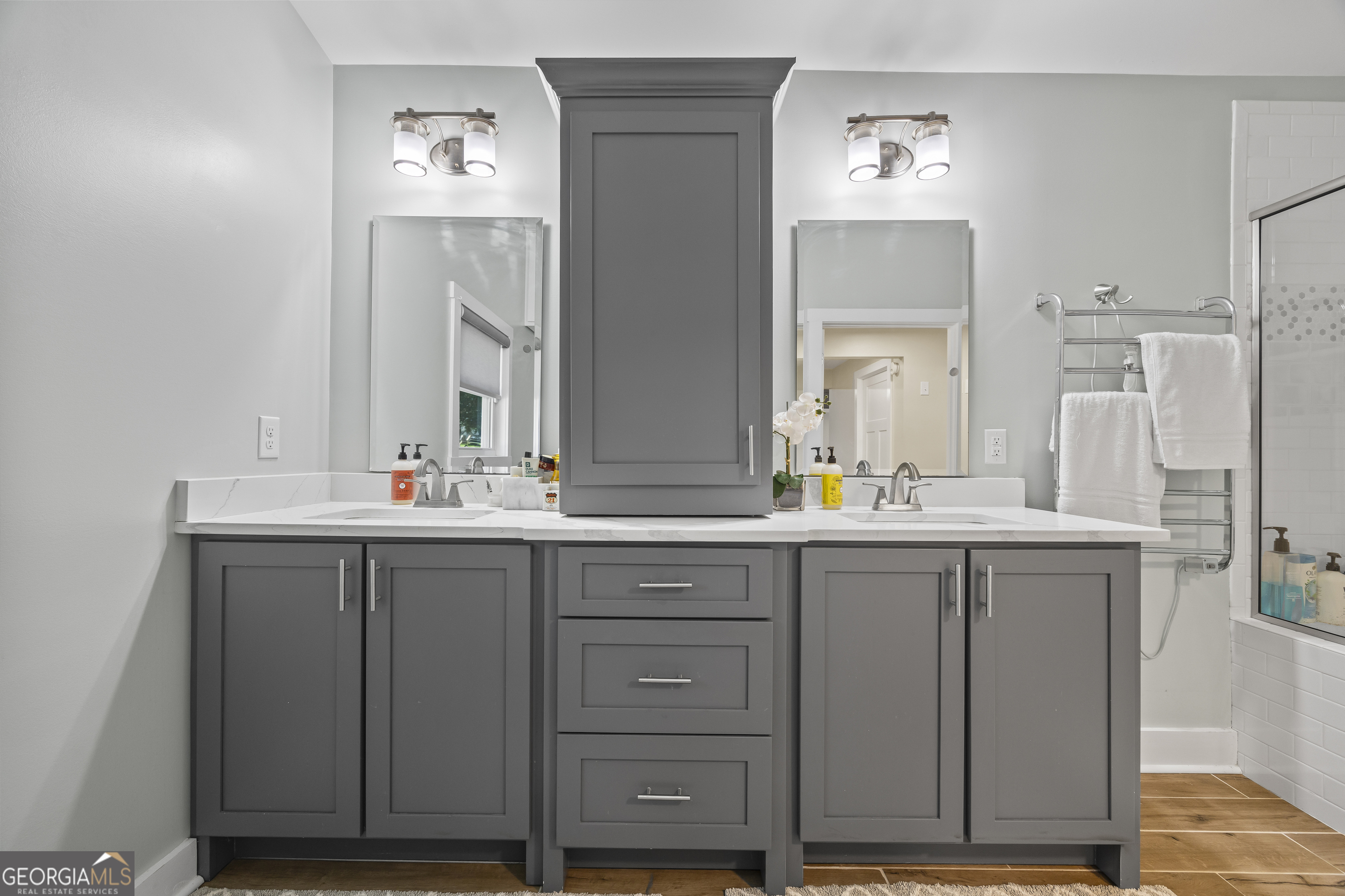 711 Shackelford Road Royston, GA 30662 - Photo 24 of 50 a bathroom with a double vanity sink and mirror