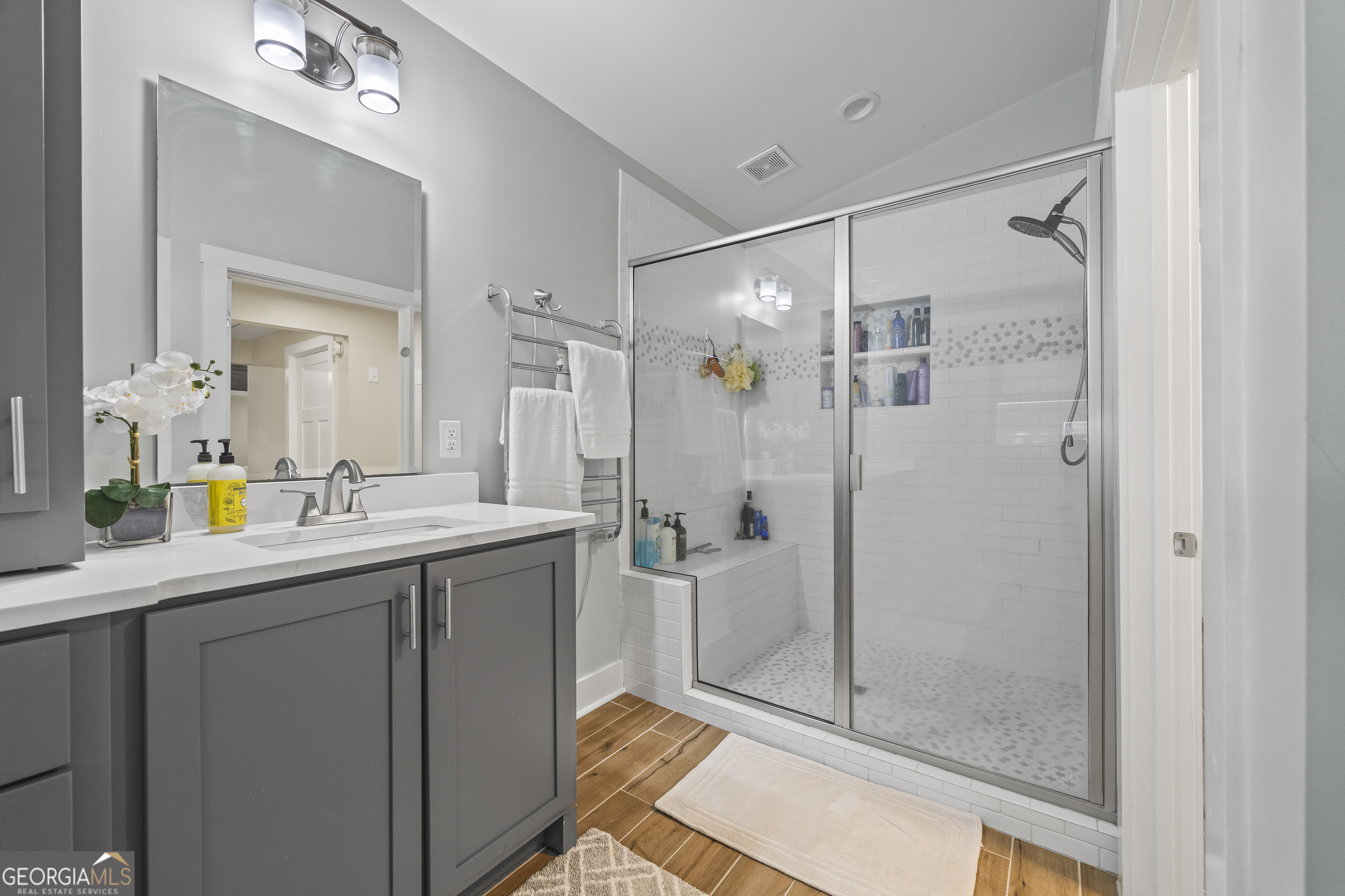 711 Shackelford Road Royston, GA 30662 - Photo 25 of 50 a bathroom with a shower sink and mirror