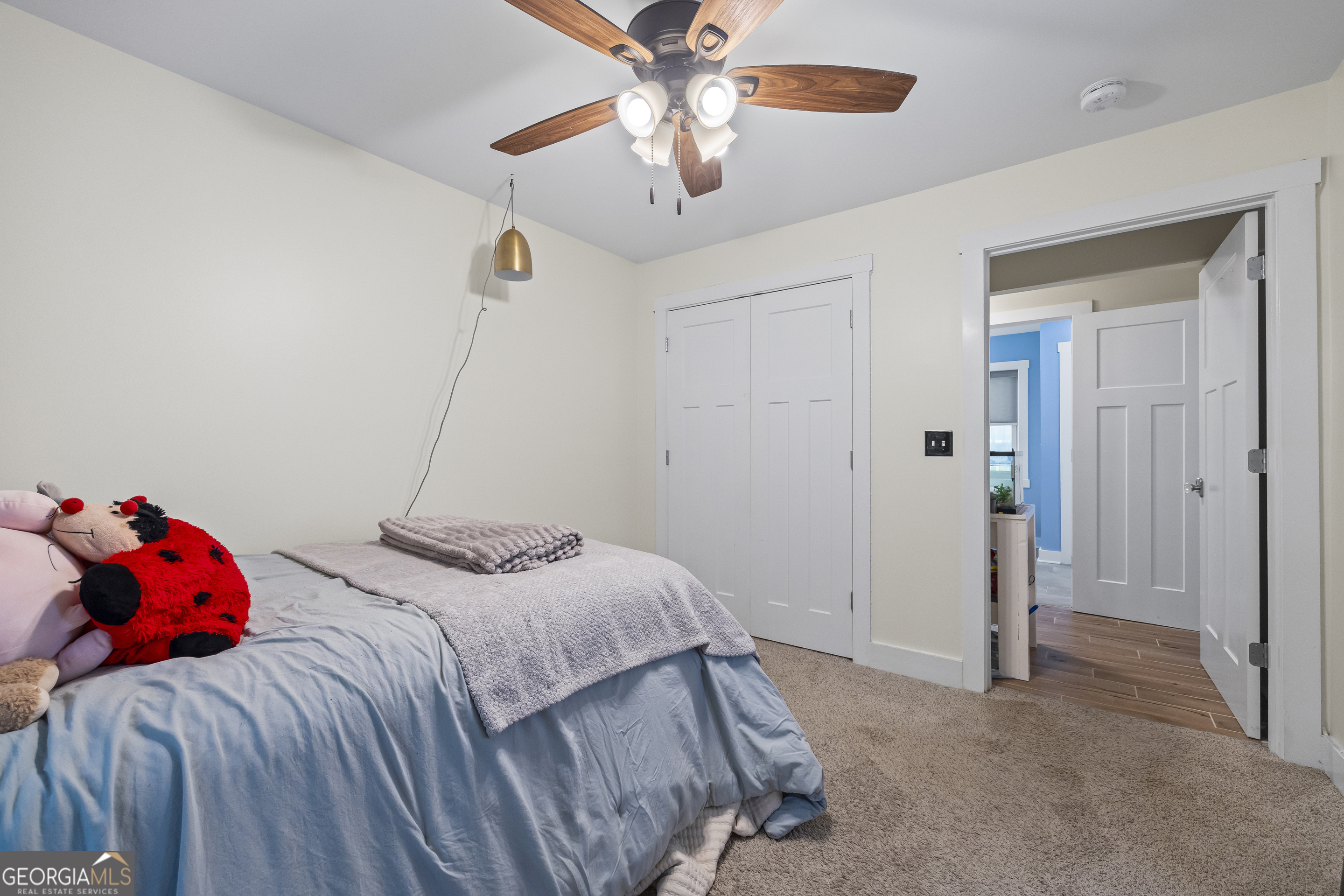 711 Shackelford Road Royston, GA 30662 - Photo 30 of 50 a bedroom with a bed and a chandelier