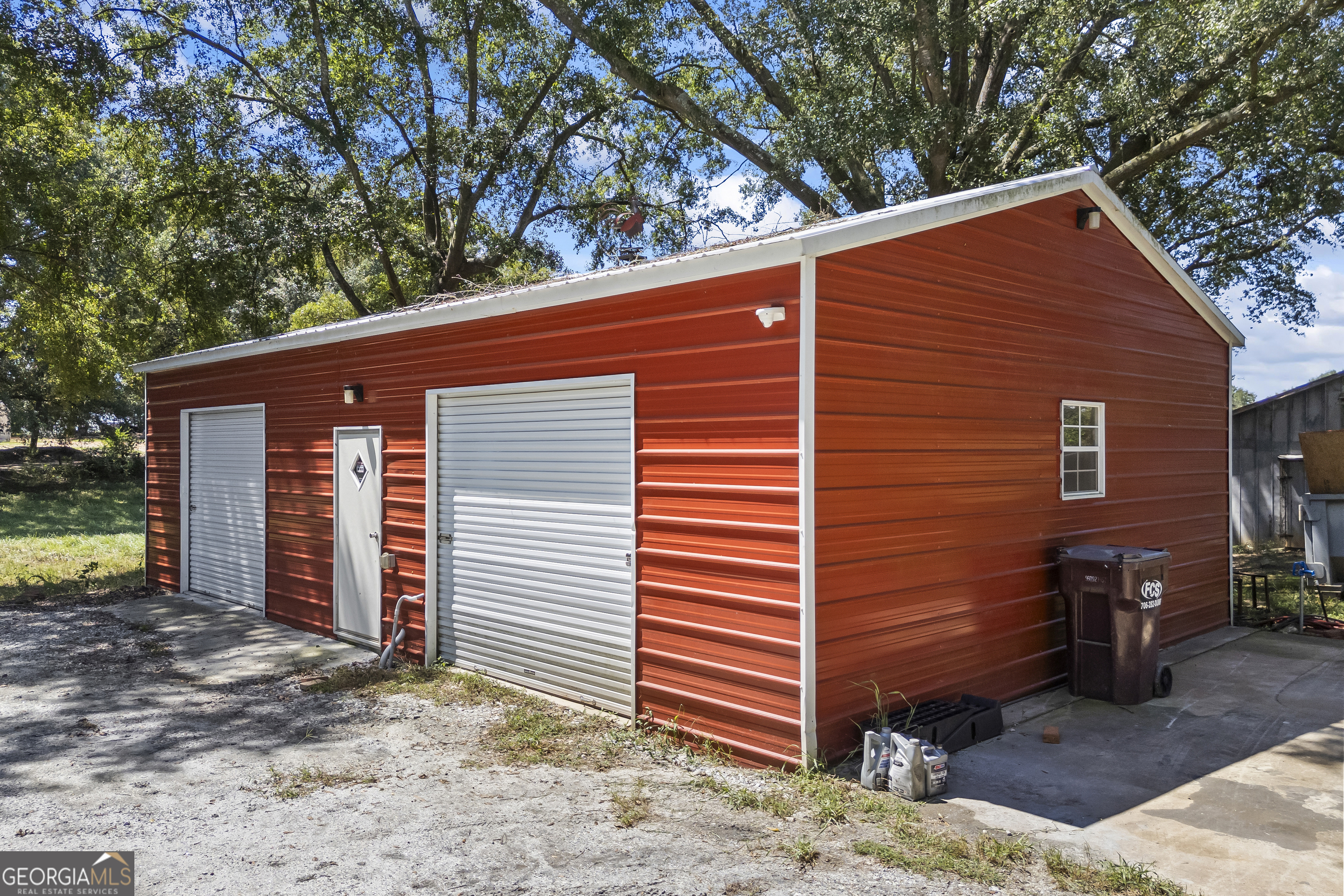 711 Shackelford Road Royston, GA 30662 - Photo 37 of 50 a view of a house with a yard and garage