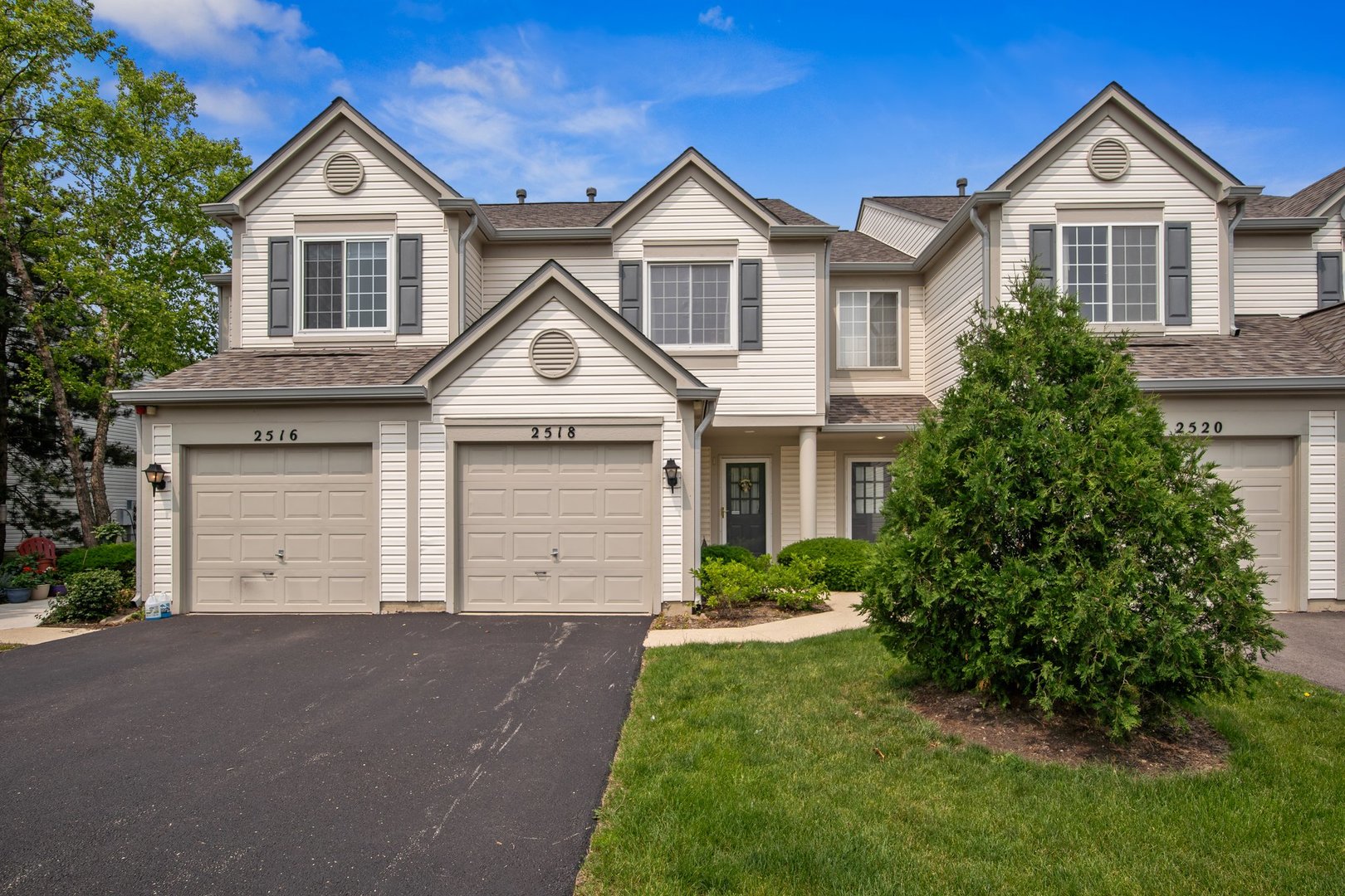 2518 Arcadia Circle Naperville, IL 60540 - Photo 1 of 1 a front view of a house with a yard and garage