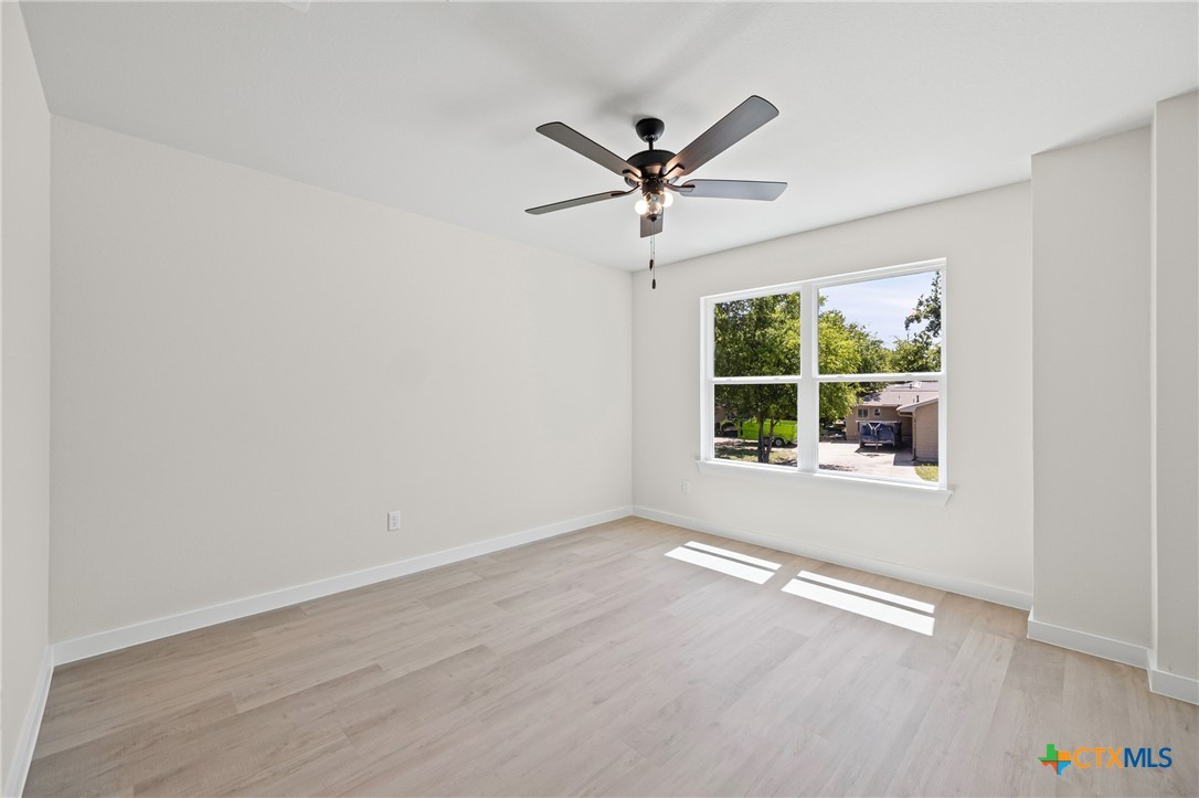 602 South 18th Street, Unit B Temple, TX 76501 - Photo 19 of 24 a view of a big room with wooden floor closet and windows