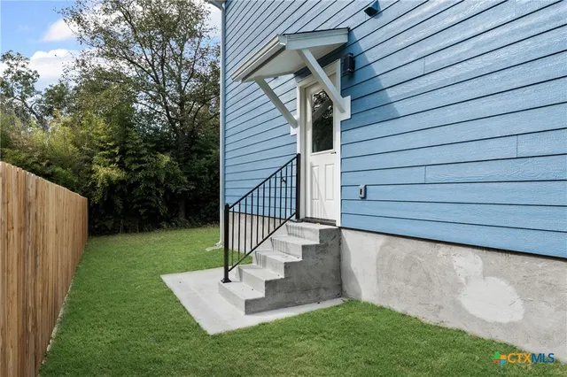 a view of a back yard with a garden